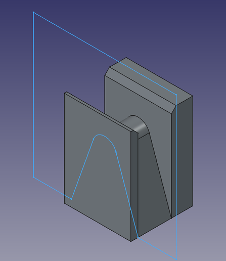 A simple sketch overlayed on the drawing, showing how material was removed from the cube shape to model the nose portion of the sunglasses.