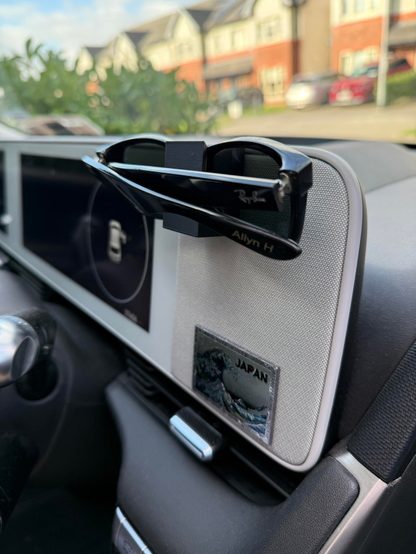 3D printed sunglasses holder, mounted in my car. 